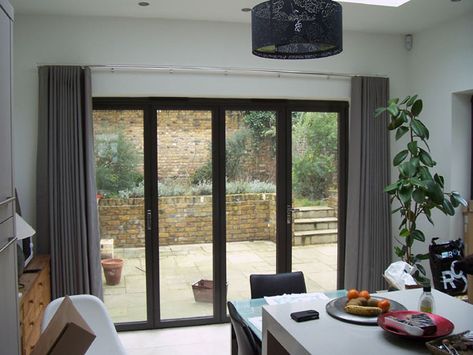 Wave system curtains stacking back neatly on chrome 30mm Silent Gliss Metropole Curtains Over Bifold Doors, Silent Gliss Wave, Bifold Doors With Curtains, Bifold Curtains, Slider Door Window Treatments, Bifold Blinds, Curtains For Bifold Doors, Big Window Curtains, Sunroom Blinds