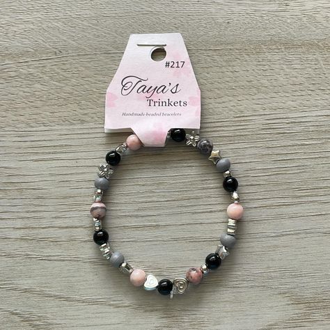 #217 Handmade beaded elasticized bracelet; variegated pink beads, grey small beads, black small beads, variety of silver spacers. Single strand , Cdn $15 each, shipping extra. Order at tayastrinkets500@gmail.com #handmadebracelet #beadedbracelet #greyandpinkbracelet Bracelets Handmade Beaded, Pink Beads, Handmade Bracelets, Beaded Bracelets, Beads, Pink, Silver, Black