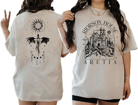 PRICES MAY VARY. AWESOME SHIRT: Dive into the mythical world of Aretia with this captivating T-shirt, featuring intricate designs inspired by the legendary riders and their formidable dragons. This Xaden Riorson House Aretia shirt is perfect for fans of fantasy adventures and dragon lore. DETAILS: 100% cotton. Antique colors & Sport Grey: 90/10 cotton/polyester. Ash Grey: 99/1 cotton/polyester. Medium fabric (5.3 oz/yd² (180 g/m²)) Product color may vary slightly due to photographic lighting sou Riorson House, Dragon Lore, Flame Dragon, Mythical World, Bookish Stuff, Fourth Wing, Book Clothes, Dragon Rider, Holiday Humor