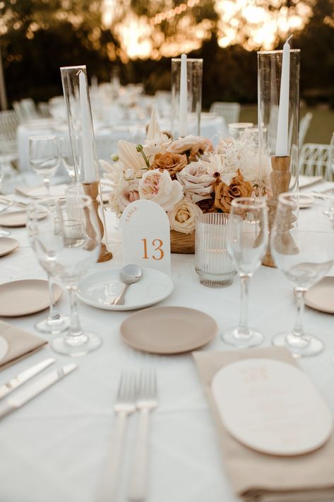 El Chorro wedding giving off Palm Springs vibes. White minimalist reception chairs and tableclothes. String lights complete the atmosphere and set up. Centerpieces were modern neutral florals with browns and tans. Geometric table numbers finish the look. This desert hip wedding is one to share!! Unique Engagement Rings Yellow Gold, Toffee Wedding, Up Centerpieces, Engagement Rings Yellow Gold, Warm Neutral Color Palette, Engagement Rings Yellow, Brown Wedding Themes, Minimalist Reception, Neutral Wedding Decor