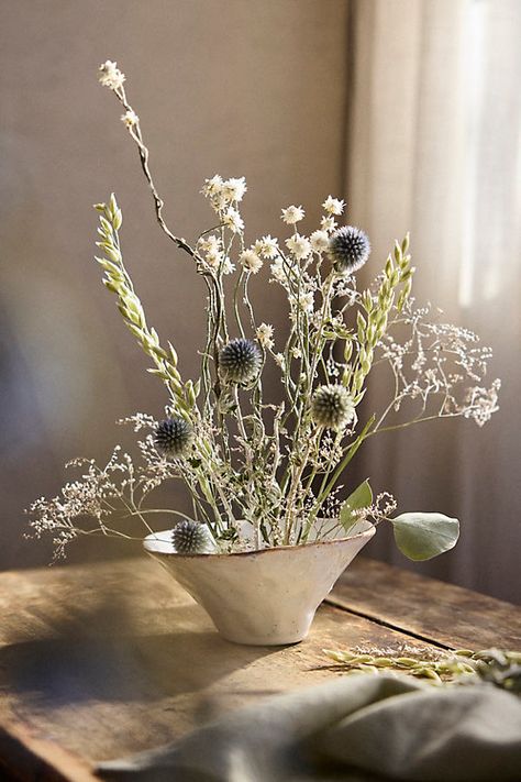 Hand-crafted with natural materials grown and harvested on a woman-owned farm in the Pacific Northwest, this dried bouquet brings home the soft scent of grassy fields. Each long-lasting bouquet features a mix of oats, eucalyptus, artemisia, thistle, and more. | Kennett Square Dried Bouquet at Terrain Boxwood Garland, Winter Floral Arrangements, Dried Flowers Wedding, Faux Hydrangea, Hydrangea Bouquet, Fiddle Leaf Fig Tree, Dried Bouquet, Flower Spray, Dried Floral