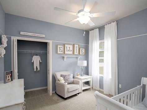 Muted blues as soft as a baby's touch give this nursery a calming feel. Painted in Jubilee Paint SW 6248, similar to Moody Blue SW 6221 Sherwin Williams Jubilee, Blue Girls Nursery, Sherwin Williams Storm Cloud, Blue Nursery Girl, Blue Gray Paint Colors, Blue Gray Paint, Nursery Room Design, Home Inventory, Blue Paint Colors