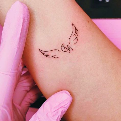 Angel Wings Initial Tattoo, Small Angel Tattoos For Women, Tattoos Elegant, Couple Wrist Tattoos, Name Tattoo On Hand, Angel Tattoo For Women, Tiny Wrist Tattoos, Alphabet Tattoo Designs, Initial Tattoo