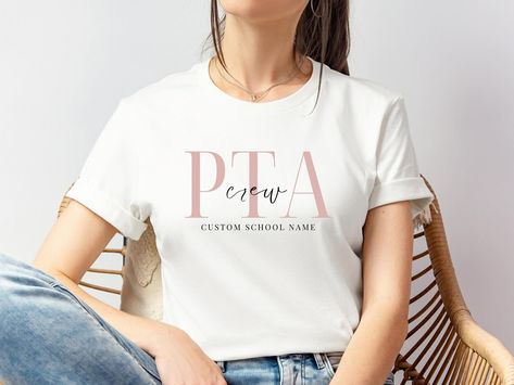 Show your school spirit with our stylish PTA and PTO shirts! Perfect for parents who are as dedicated to style as they are to school involvement. 🏫✨ LINK TO SHOP IN BIO 🔗‼️ 50% OFF WHOLE STORE 🏷️💯Customize with your school’s name and support your local programs in style! #PTAShirt #PTOShirt #SchoolSpirit #ParentTeacherAssociation #ParentTeacherOrganization #CustomSchoolGear #SupportSchools #SchoolPride #ParentInvolvement #EducationalSupport #CommunityStrong #LocalSchools #ParentLife #teachers... Pta Mom, Pta Shirts, Pta Events, Pta Moms, School Spirit Days, Spirit Days, Bold Letters, School Community, Mama T Shirt