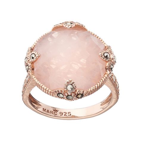 Adorned with a round-cut genuine rose quartz center stone and marcasite stone accents, this 18k rose gold over sterling silver ring abounds with breathtaking beauty.RING DETAILSWidth: .67 in. Metal: sterling silverPlating: 18k rose goldSTONE DETAILSStone type: rose quartzCenter stone weight: 7 1/3 ct.Center stone size: 17 mm Shape: roundSetting: bezelGemstones may have been treated to enhance their appearance. Special care may be required. Color: Multicolor. Gender: female. Age Group: adult. Pink Gold Rings, Marcasite Jewelry, Rose Gold Quartz, Rose Quartz Ring, Circle Ring, Spiritual Jewelry, Rose Gold Jewelry, Quartz Ring, Lovely Jewellery