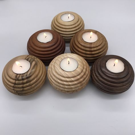 "A beautiful Ash wood turned tea light holder made in a \"bee hive\" design hand oiled and burnished to give a satin glow. It is from our own sourced milled and dried ash wood which we obtain from local farmers and land owners. It measures approximately 100mm diameter by 60mm high. One white tea light candle is included. We can make tea lights to your design in a variety of woods and can do most commissions." Wood Turning Christmas Ornaments, Wood Lathe Projects For Beginners, Mini Lathe Projects, Wood Turning Ideas, Wood Lathe Projects, Bee Hive Design, Wood Turned Candle Holders, Turned Candle Holders, Wood Turned Bowls