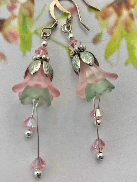 Flower Earrings . Frosted Pink And Green lucite. Genuine Swarovski Pink AB Crystals. Dangles about 2.5" in length and is .75 " in width. Silver Plated Ear wires and Components. Unique and Beautiful Earrings of both Great Quality and Design. Lucite Flower Earrings, Polymer Clay Flower Jewelry, Diy Jewelry Earrings, Pretty Jewelry Necklaces, Lucite Jewelry, Beading Jewelery, Fairy Jewelry, Clay Flower, Beaded Earrings Patterns