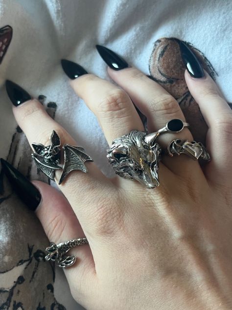 silver rings bat wolf jewellery aesthetic Werewolf Jewelry Aesthetic, Silver Goth Rings, Goth Aesthetic Jewelry, Vampire Accessories Aesthetic, Emo Rings Aesthetic, Gothic Jewelry Aesthetic, Wolf Aesthetic Outfit, Gothic Rings Aesthetic, Vampire Jewelry Aesthetic