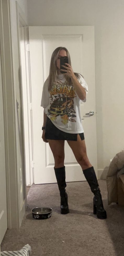 Graphic Tee And Black Skirt Outfit, Black Mini Skirt Oversized Tee, Tshirt With Mini Skirt Outfit, Big T Shirt With Skirt, Skort With Oversized Shirt, Black Boots Mini Skirt Outfit, White Tshirt Black Skirt Outfit, Oversized Shirt Mini Skirt Outfit, Streetwear Outfit With Skirt