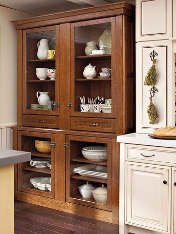 An antique China hutch inspired the look of this storage piece made from ordinary kitchen cabinetry. Storage Hutch, Kitchen Hutch, Pantry Storage Cabinet, Casa Country, Diy Kitchen Storage, Antique Kitchen, Kitchen Redo, Kitchen Cabinetry, Kitchen Pantry