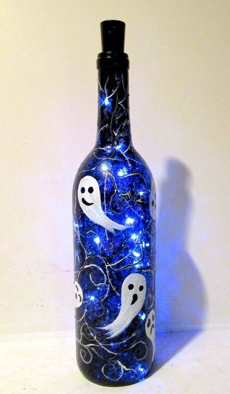 Halloween Painted Wine Bottles, Blue Wine Bottle Crafts, Halloween Wine Bottle Crafts, Spray Painted Wine Bottles, Tree Fairy Lights, Fall Wine Bottles, Halloween Wine Bottles, Blue Wine Bottles, Spooky Tree