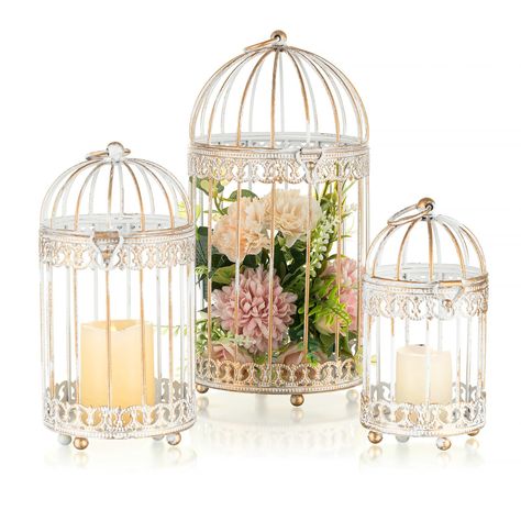 PRICES MAY VARY. 【Distressed Design】The NUPTIO birdcage lanterns candleholder is made of high-quality metal, with fine polishing, painting, and distressed craftsmanship, making it durable and resistant to corrosion. It not only serves as a candle holders for pillar candles, but also functions as a exquisite piece of artwork. This pillar candle holder is available in both gold and rustic white, adding a shabby chic and elegant atmosphere to your home or event decoration. 【Hanging & Sitting】The NU Bird Cage Candle Holder, Porch Office, Shabby Chic Wedding Decor, Lantern Centerpiece, Antiqued Candle Holders, Lantern Centerpieces, Lantern Candle Decor, Bird Cage Decor, Vintage Bird Cage