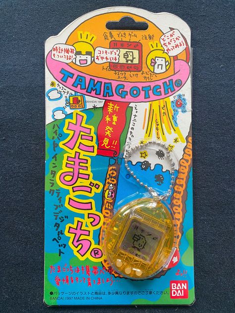 Bandai 1997 Tamagotchi Clear Yellow Color Ver Electronic Virtual Pet Digivice Toy. Virtual Pet Size: 4.5 cm x 5 cm x 2 cm Large. The Package Size: 10 cm x 20 cm Large,Japanese Version. In Brand New Condition.Mint in Plastic Card Package,Vintage Item. Original Made in Bandai 1997,Don't Miss the Rare item. Vintage Action Figure Packaging, Retro Toy Packaging, Tamagotchi Packaging, Japanese Toy Packaging, Vintage Toy Packaging, Vintage Japanese Toys, Tomogatchi Toy, Vintage Tamagotchi, Brand Card