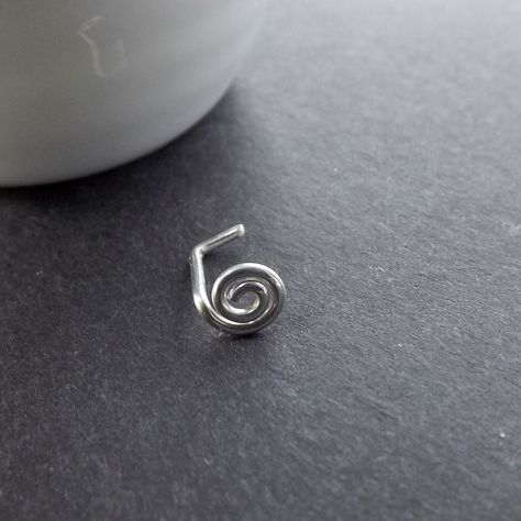 Sterling silver tiny coiled stud single. I created this little coil nose stud from eco friendly recycled sterling silver wire; formed it into this tiny round coiled shape and sanded the end smooth for comfort in wearing.  From the back of the little coil to the bend is approximately 6mm; the little end is 3-4mm.  Please see the measurement photo for an accurate idea of the size of this little stud. Your little swirl coil nose stud will arrive nicely boxed and ready for giving. To get to my shop' Cute Nose Studs Unique, Funky Nose Ring, Unique Nose Piercing Jewelry, Nose Jewelry Silver, Spiral Nose Piercing, Nose Piercing Unique, Silver Nose Jewelry, Ladybug Nose Stud, Cool Nose Studs