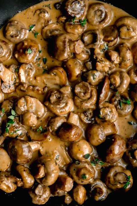 Cremini and button mushrooms sauteed in butter and garlic. Then quickly simmered in a creamy parmesan sauce until tender. The perfect topping to pork or steak off the barbecue or just eat'em all by themselves! #creamygarlicmushrooms #garlicmushrooms #sauteedgarlicmushrooms #garlicmushroomsrecipes #mushroomrecipes #garlicmushroomsauce # Mushroom Topper For Steak, Sauteed Button Mushrooms, Steak Toppers, Cremini Mushroom Recipes, Creamy Mushroom Steak, Thanksgiving Mushrooms, Mushroom Side Dish Recipes, Keto Prep, Mushrooms Sauteed