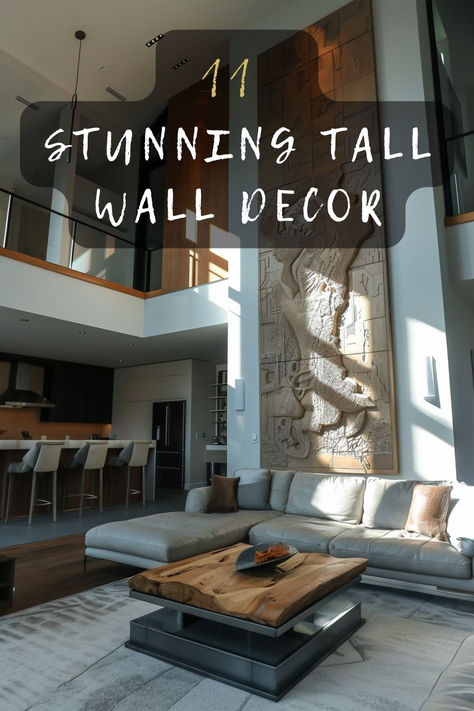 Looking for tall wall decor inspiration? Discover 11 must-have ideas that can bring style and sophistication to your high-ceilinged space. Click to find out which designs could be perfect for you. 🖼️🛋️ #TallWallDecor #HighCeilings #HomeStyling #InteriorDesign #DecorInspo Tall Exterior Wall Ideas, Tall Wall Gallery Ideas, 2 Story Foyer Artwork, How To Decorate Tall Walls High Ceilings Kitchen, High Ceilings Wall Decor, High Wall Decorating Ideas Living Rooms, Big Wall Decor Living Room Tall Ceilings Open Spaces, High Ceiling Wall Ideas, Tall Living Room Wall Decor Ideas