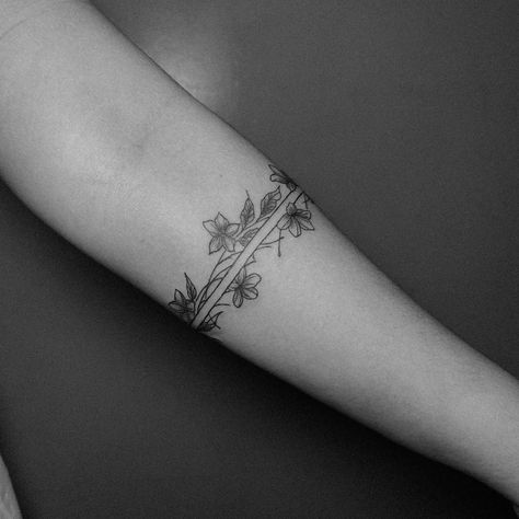 An armband tattoo featuring sampaguita flowers often carries cultural and personal significance. The sampaguita, also known as the Philippine jasmine, is the national flower of the Philippines. It symbolizes purity, simplicity, humility, and strength. In the context of an armband tattoo, it may represent pride in Filipino heritage, a connection to one’s roots, or the embodiment of the qualities that the flower symbolizes. Additionally, armband tattoos can signify continuity, protection, and l... Filipino Arm Band Tattoo, Hmong Tattoo Design For Women, Filipino Tattoos Women, Philippine Tattoo Design, Philippine Symbols, Filipino Tribe Tattoo Women, Sampaguita Flower Tattoo Philippines, Filipino Sun Tattoo Women, Filipino Tattoos Women Traditional