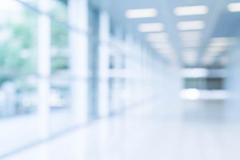 Blurred abstract background interior view looking out toward to empty office lobby and entrance doors and glass curtain wall with frame Photo | Free Download Ceo Headshots, Wooden Floor Pattern, Herringbone Wooden Floors, White Wooden Chairs, Empty Rooms Interior, White Square Tiles, Burgundy Walls, Dark Grey Walls, Dark Blue Walls