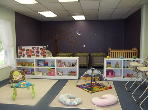 The separation in this room between a napping/resting area and the play areas is great. Daycare Baby Room Ideas, Home Daycare Rooms, Infant Room Ideas, Daycare Room Ideas, Infant Room Daycare, Daycare Setup, Daycare Spaces, Home Daycare Ideas, Infant Daycare