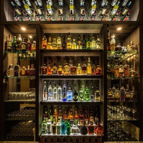 The selection of beer, wine and liquor in this hidden bar is second-to-none... Whisky Bar Home, Hidden Bar Ideas For Home, Liquor Room, Wine Shop Interior, Bar Alcohol, Ames Iowa, Whiskey Room, Alcohol Bar, Liquor Shop