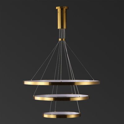 A minimalist expression of modern glamour, this Meranda 3-tier chandelier is in a class of its own. Three tiers of illuminated halos in clean white metal cascade as if floating in midair, creating an illusionary display that transforms any living space with rich depth and motion. Finish: Gold | Safavieh Couture Meranda 3 Tier Chandelier Metal in Yellow | Wayfair Bronze Modern Chandelier, Modern Entryway Chandelier, Large Chandelier High Ceilings, Family Room Chandelier, Chandelier Pink, Tier Chandelier, Entryway Lighting, Chandelier Metal, Wood Chandelier