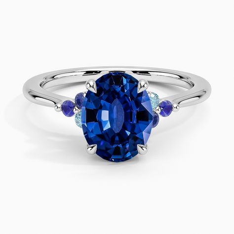 Lab Grown Sapphire Indigo Melody Engagement Ring - Platinum. This whimsical ring features a dazzling cluster of aquamarines, lab sapphires, and lab alexandrites framing each side of the center gem. The gently tapering band and open gallery creates a light and lustrous look. Whimsical Ring, Round Halo Ring, Stacked Engagement Ring, Open Gallery, September Birthstone Rings, Trio Ring, Gold Promise Rings, Dainty Gold Rings, Rainbow Rings