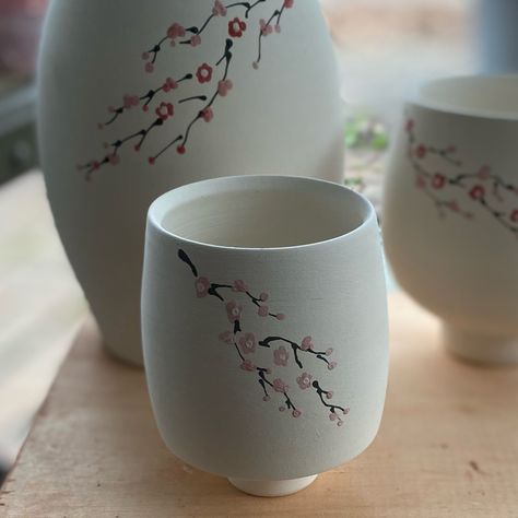 Cherry blossom yunomi . . . . #cherryblossom #porcelain #ceramics #handpainted #ceramicsofinstagram #wheelthrownceramics Cherry Blossom Mug Painting, Cherry Blossom Tea Set, Ceramic Glass Design, Japanese Pottery Painting, Painting On Ceramics Ideas, Cherry Blossom Pottery, Paint Cherry Blossom, Cherry Blossom Ceramic, Cherry Blossom Mug