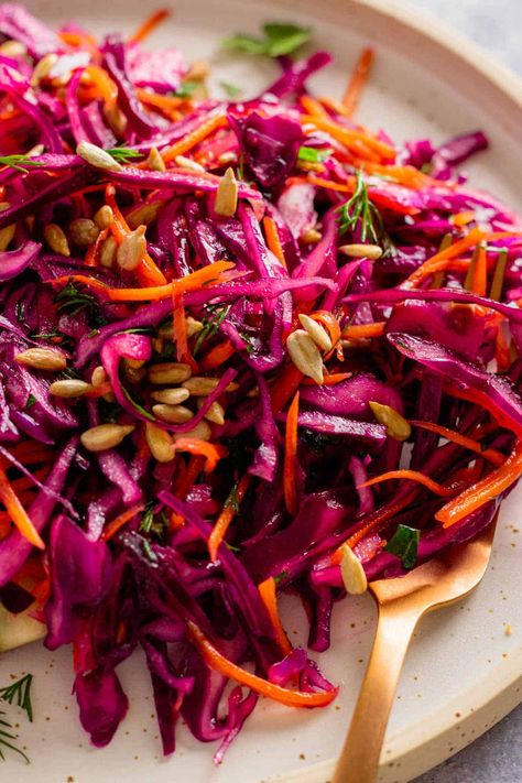 Looking for a crunchy salad with a light, tangy dressing? Try this red cabbage salad - it's perfect for any occasion, from weeknight dinners to potlucks. Top it up with some fried chicken or roasted salmon. Red Cabbage And Beet Salad, Salad Red Cabbage, Red Cabbage Salad Recipes, Roasted Red Cabbage, Red Cabbage Recipes, Red Cabbage Salad, Healthy Snack Bars, Cabbage Salad Recipes, Side Salad Recipes