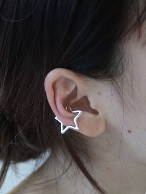 Different Earrings In Each Ear, Cute Piercings Ears Simple, Star Conch Piercing, Star Ear Cuff, Star Piercing Ear, Ear Piercings Star, Unique Piercings Ears, Ear Piercings Cute, Two Ear Piercings