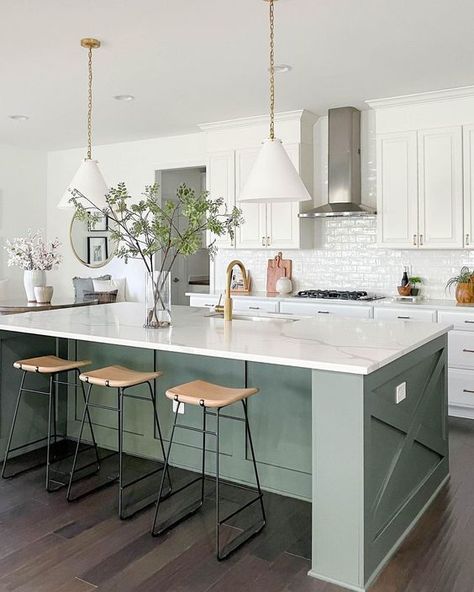 a white farmhouse kitchen with shaker style cabinets, an olive green kitchen island, white stone countertops and white pendant lamps Contrasting Kitchen, Contrasting Kitchen Island, Green Kitchen Island, White Shaker Kitchen Cabinets, White Shaker Kitchen, Green Island, Green Kitchen Cabinets, Kitchen Island Ideas, White Kitchen Decor