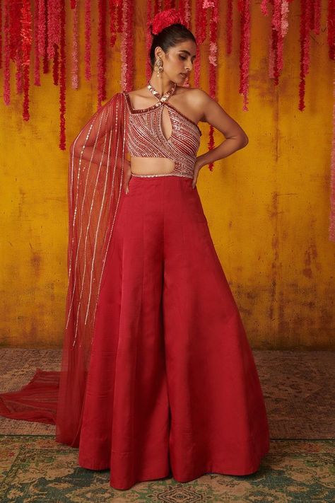 Buy #ruby #red embroidered #jumpsuit in #sequins and cutdana work with flared pant and attached drape by #PinkPeacockCouture at #AzaFashions Shop online now at #Azafashions.com Call +91 8291990059 or email contactus@azafashions.com for enquiries. #wedding #festive #ethnic #tradional #shopping #shoponline #party #reception #bride Peacock Couture, Embellished Jumpsuit, Embroidered Jumpsuit, Elevated Casual, Pink Peacock, Chic Tops, Designer Jumpsuits, Wedding Dresses For Girls, Party Wear Indian Dresses