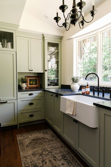 Sage Kitchen Cabinets Black Counters, Sage Green Kitchen Cabinets Dark Counters, Green Tuxedo Kitchen Cabinets, Sage Green Kitchen Dark Counter, Green Cabinet With Black Hardware, Sage Kitchen Black Countertops, Green Cabinets Kitchen Black Hardware, Sage Green Kitchen With Black Granite, Sage Green And Black Kitchen Ideas