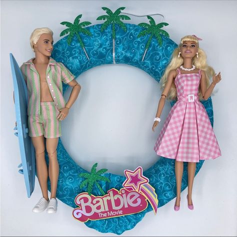 So Sweet Studio Designs Barbie The Movie Wreath. Handmade And Brand New. Barbie Is All The Rage And This Fun And Vibrant Wreath Won't Disappoint! Barbie And Ken Adorn The Swirls Of Turquoise Fabric Wrapped Wreath, Finished Off With A Barbie The Movie Logo And Sparkly Green Palm Trees! So Much Fun!!! In Your Favorite Child's Bedroom, A Playroom, Or Den, This Wreath Will Brighten The Hearts Of Those That See It. Even Great For Adult Barbie Fans! The Barbie Wreath Is Delicate And Meant For Indoor U Barbie Wreath, Barbie Home Decor, Barbie Home, Barbie Christmas Tree, Green Palm Trees, Barbie Christmas, Barbie The Movie, Movie Logo, Barbie Room