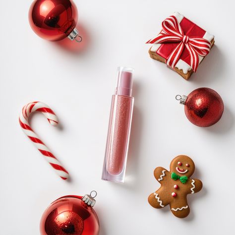 AI cosmetics Photography, A glistening lip gloss tube is surrounded by vibrant Christmas ornaments, a twisted candy cane, and a delightful gingerbread man cookie. This photo captures the essence of holiday beauty essentials, serving as inspiration for simplistic yet vivid product photography. Winter Core, Candy Photoshoot, Product Photography Studio, Digital Marketing Design, Holiday Beauty, Holiday Photography, Pink Lip Gloss, Holiday Glam, Cosmetics Photography