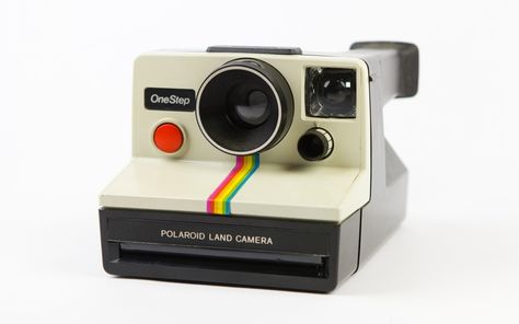 First founded in 1937, Polaroid owes much of its success to the instant camera. Long before digital cameras, the Polaroid instant camera allowed photographers to see their picture almost instantly - instead of waiting for it to be developed. Envisaged in 1943, it wasn't until the release of the SX 70 and the OneStep that they really took off - with the latter becoming the most sold camera in the US. Polaroid Camera Film, Polaroid Instant Camera, Vintage Polaroid Camera, Polaroid Snap, Polaroid One Step, Instant Print Camera, Instant Film Camera, Polaroid Camera, Vintage Polaroid