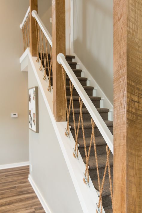 Boat cleats and natural sisal rope create a nautical stair banister #troveonthego #lakehouse #stairs #banister #nauticaldesign #interiordesign #designinspiration Nautical Staircase Ideas, Nautical Staircase, Nautical Stairs, Stairs Banister Ideas, Boat Stairs, Rope Stair Railing, Rope Stairs, Staircase Banister Ideas, Boat House Decor