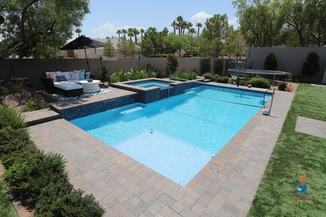 To accommodate the active family's lifestyle,a large sport pool with a raised spa has room to swim laps, play water volleyball or basketball! #sportpool #residentialpool #customswimmingpools #watervolleyball #waterbasketball #lapswimming Pool Budget, Geometric Pools, Sports Pool, Custom Water Feature, Geometric Pool, Rectangle Pool, Beach Entry Pool, Sport Pool, Residential Pool