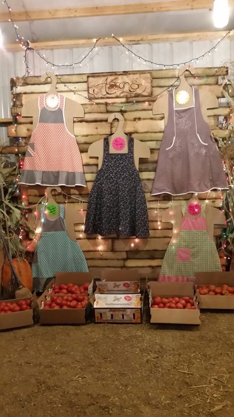 Apron display ideas Display Aprons At Craft Show, Apron Display Ideas Craft Fairs, How To Display Aprons At A Craft Show, Apron Display Ideas, Display Aprons, Apron Display, Market Stall Display Ideas, Boutique Window Displays, England Kitchen