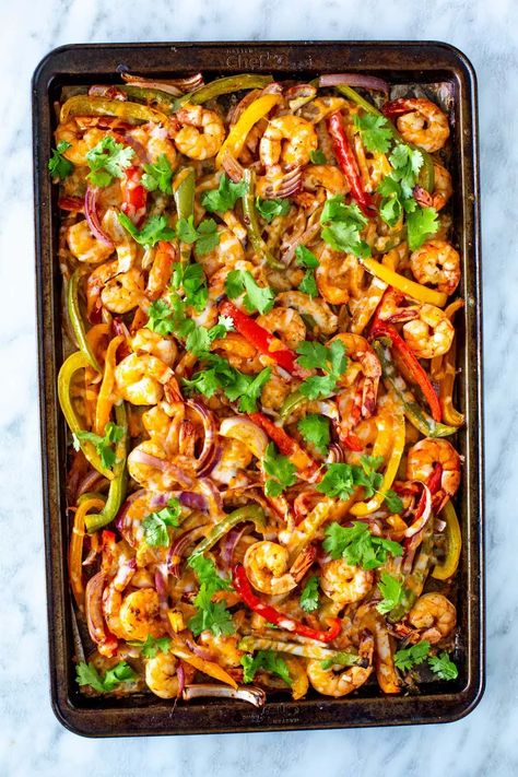 These easy Sheet Pan Shrimp Fajitas are a quick 30-minute dinner! Just marinate shrimp, bake with peppers, then load up your tortillas. Click here for the recipe. Fajita Recipe Shrimp, Marinate Shrimp, Shrimp Bake, Shrimp Fajita Recipe, Slow Cooker Meal Prep, Sheet Pan Shrimp, Pan Shrimp, Shrimp Fajitas, Dinner Prep