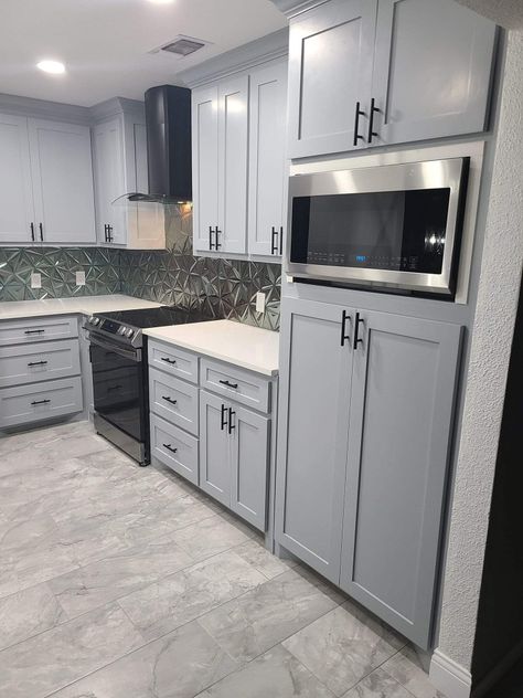 Grey Cabinets Black Hardware, Light Gray Cabinets Kitchen, Warm Gray Kitchen Cabinets, Kitchen Cabinets With Gray Floors, Cabinets With Gray Floors, Trending Kitchens 2024, Colors Kitchen Cabinets, Cabinet Makeover Kitchen, Light Grey Cabinets