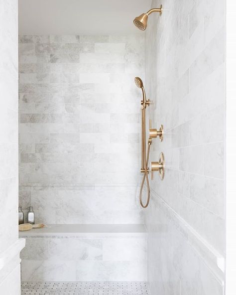 Rethink the way you see stone with Siberian Pearl Marble. This truly versatile stone softens a design while enhancing its beauty. Love this look? Schedule a free design consultation. Link in bio. ​Design by @Timbertrailshomes. ​Photo by @stofferphotographyinteriors. Shower Wall Tile, Marble Showers, Gold Shower, Transitional Bathroom, Shower Niche, Master Bath Remodel, The Tile Shop, Inspiration Photos, Main Bathroom