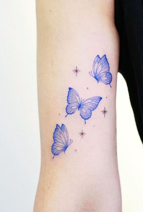 Blue Butterfly Hand Tattoo, Small Butterfly Tattoo Blue, Blue Outline Butterfly Tattoo, Light Blue Tattoo Ink, Tattoo Blue Butterfly, Lilac Butterfly Tattoo, Blue Buterfluffy Tattoo, Tiny Blue Butterfly Tattoo, Light Blue Butterfly Tattoo