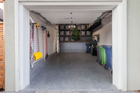 The concrete flooring and foundation were finished with a Nightfall Floortex floor coating. Gray slatwalls were installed with hooks and baskets to increase the amount of wall storage. A four foot LED light brightens up the space and the entire garage was painted to make it all look like new. Storage bins were also used to reduce the clutter and keep the space looking tidy. 1 Car Garage Organization Ideas, Single Car Garage Organization, Small Garage Design, Garage Organizer, One Car Garage, Garage Design Interior, Garage Organization Tips, Garage Apartment Plans, Small Garage