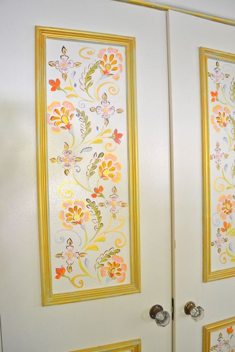 Painting I did inside of the paneling in my closet doors. Warm, colorful floral framed by gold. I sketched out my design directly on the door with pencil first. This is a great weekend DIY project to add interest to a room. For more inspiration, visit my blog at DenaDesigns.com Flowers On Door Painting, Art On Doors Paint, Decorated Closet Doors, Floral Door Painting, Painted Closet Doors Art Creative, Door Frame Painting Ideas, Closet Painting Ideas Aesthetic, Painted Closet Doors Aesthetic, Painted Door Designs