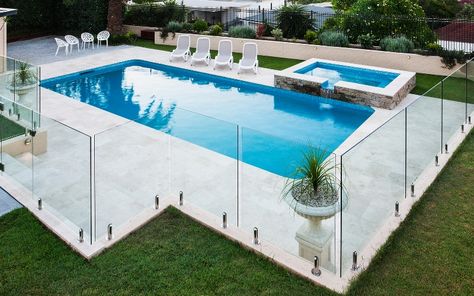 Attached spas and upgraded glass pool fencing are examples of things to cut out of your plans if you want to build the cheapest pool possible. To clarify your thoughts, consider making a list of Wants and Needs for your new pool. Wants can go out the window if you need to trim your budget. Cheap Inground Pool, Mesh Pool Fence, Pool Patio Designs, Glass Pool Fencing, Cheap Pool, Pool Fencing, Glass Fence, Glass Pool, Front Yard Fence