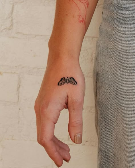 Moth Tattoo On Wrist, Small Moth Tattoo Design, Tiny Moth Tattoo Simple, Mini Moth Tattoo, Minimalist Moth Tattoo, Moth Finger Tattoo, Moth Tattoo Minimalist, Moth Tattoo Hand, Moth Tattoo Fine Line