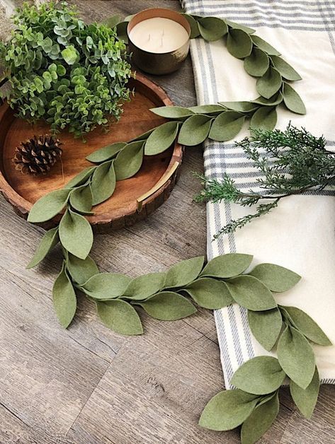 diy beauty Beautiful magnolia leaf garlands made of premium acrylic felt! Felt is made in the USA fr Felt Xmas Decorations, Cer Nocturn, Magnolia Leaf Garland, Felt Garlands, Magnolia Leaf, Fabric Leaves, Fall Leaf Garland, Felt Leaves, Felt Christmas Decorations