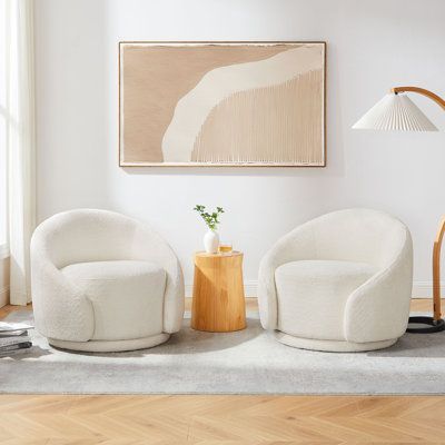 The generous proportions of this set of 2 swivel chairs ensure they are the statement in any space, while their gentle curvature and welcoming boucle or glam velvet upholstery add an unmatched relaxed tone. 360 degree round base allows you to sit on and swivel effortlessly. The accent chair's round silhouette gives it a fun yet elegant feel that is guaranteed to make a gorgeous statement in your living room, bedroom or lounge area. Fabric: White Boucle | Barrel Chair - Brayden Studio® Blaklee 34 Sitting Area Chairs, White Lounge Chair, Bedroom Seating Area, Leather Sofa Chair, Leather Sectional Sofas, Bedroom Seating, Swivel Barrel Chair, Accent Arm Chairs, Upholstered Arm Chair