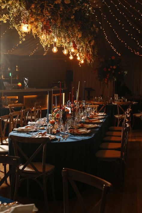 Claire and Kevin envisioned a dinner party atmosphere for their reception, with navy velvet linens, hand-painted velvet ribbon place cards, and overflowing florals and fruits as centerpieces. Danish candles added a soft glow, creating the perfect ambiance. Planner: @tarafayevents Florals: @flowersbymoira Photography: @brettharkness Stationary & Invitations: @grosvenorstationerycompany Linens: @totalevent.ie Monogram: @sarahodea Venue: @Virginia_park_lodge . . . . . #Tarafayevents #tarafay #... Jewel Tone Tablescape, Moody Dinner Party, Ribbon Place Cards, Moody Tablescape, Painted Velvet, Winter Dinner Party, Midnight Garden, Long Holiday, Holiday Dining