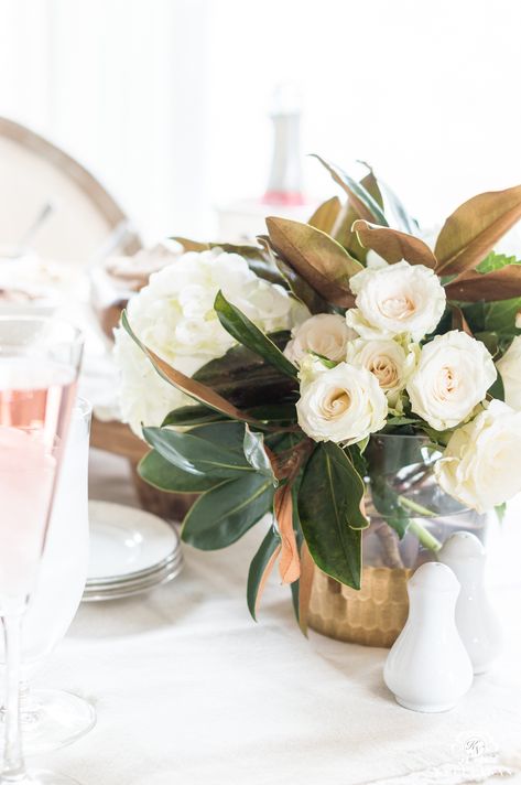 Rose, hydrangea, and Magnolia leaf table centerpiece for a Galentine's luncheon Sweet Potato Bar, Magnolia Leaves Centerpiece, Magnolia Centerpiece, Potato Bar, Kitchen Table Centerpiece, Magnolia Wedding, Magnolia Table, By The Numbers, Rose Centerpieces